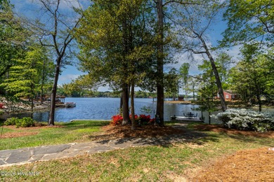 Priced to Sell! Stunning Waterfront Home on Rare Double Lot in on River Golf and Country Club at Lake Royale in North Carolina - for sale on GolfHomes.com, golf home, golf lot