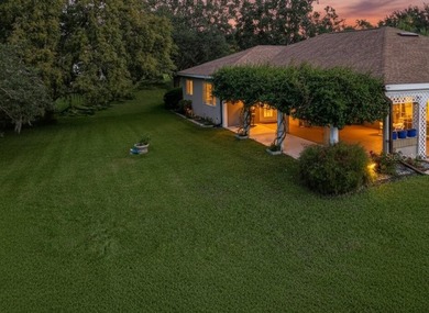 Under contract-accepting backup offers. Lovely stucco 3 on Eagle Ridge At Spruce Creek Country Club in Florida - for sale on GolfHomes.com, golf home, golf lot