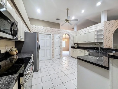 Under contract-accepting backup offers. Lovely stucco 3 on Eagle Ridge At Spruce Creek Country Club in Florida - for sale on GolfHomes.com, golf home, golf lot