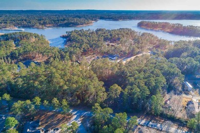 Nestled in a coveted enclave of Rayburn Country, this on Rayburn Country Club in Texas - for sale on GolfHomes.com, golf home, golf lot