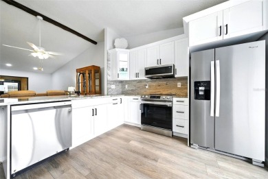 Welcome to this beautifully remodeled villa in the heart of Palm on Highland Lakes Executive Golf Course in Florida - for sale on GolfHomes.com, golf home, golf lot