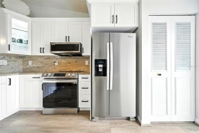 Welcome to this beautifully remodeled villa in the heart of Palm on Highland Lakes Executive Golf Course in Florida - for sale on GolfHomes.com, golf home, golf lot