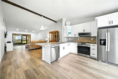 Welcome to this beautifully remodeled villa in the heart of Palm on Highland Lakes Executive Golf Course in Florida - for sale on GolfHomes.com, golf home, golf lot