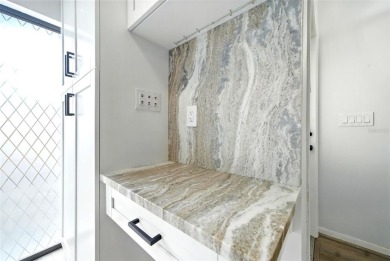 Welcome to this beautifully remodeled villa in the heart of Palm on Highland Lakes Executive Golf Course in Florida - for sale on GolfHomes.com, golf home, golf lot