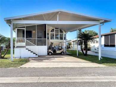 UNIQUE MOBILE HOME IN ACTIVE 55+ COMMUNITY! Two Bedrooms, two on River Run Golf Links in Florida - for sale on GolfHomes.com, golf home, golf lot