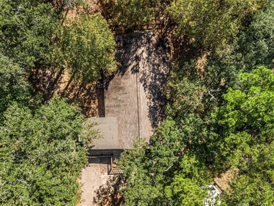 Welcome home to a warm and inviting retreat tucked away among on Holly Lake Ranch Golf Club in Texas - for sale on GolfHomes.com, golf home, golf lot