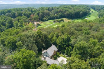 An estate drive leads through a barrel-vaulted archway to a on Caves Valley Golf Club in Maryland - for sale on GolfHomes.com, golf home, golf lot