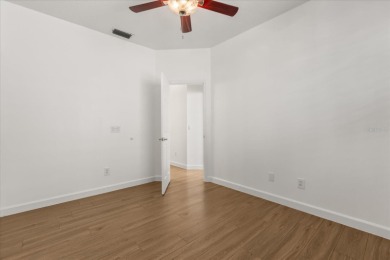 Discover this beautifully updated 4-bedroom home set along the on MetroWest Golf Club in Florida - for sale on GolfHomes.com, golf home, golf lot