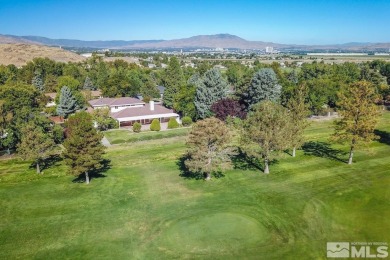 Superb custom home in one of the best golf course locations in on Hidden Valley Country Club in Nevada - for sale on GolfHomes.com, golf home, golf lot