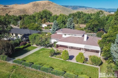 Superb custom home in one of the best golf course locations in on Hidden Valley Country Club in Nevada - for sale on GolfHomes.com, golf home, golf lot