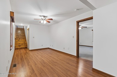 Exceptional Waterfront Retreat in beautiful Lake Royale! This on River Golf and Country Club at Lake Royale in North Carolina - for sale on GolfHomes.com, golf home, golf lot