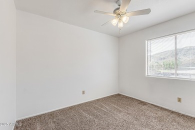 Welcome home to this charming 2-bedroom, 1.5-bath townhome on Raven Golf Club At South Mountain in Arizona - for sale on GolfHomes.com, golf home, golf lot