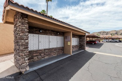Welcome home to this charming 2-bedroom, 1.5-bath townhome on Raven Golf Club At South Mountain in Arizona - for sale on GolfHomes.com, golf home, golf lot