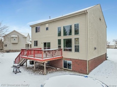 Nestled in the heart of Commerce Township, this grand 4-bedroom on Union Lake Golf Course in Michigan - for sale on GolfHomes.com, golf home, golf lot