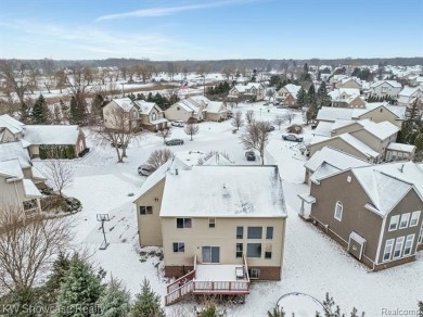 Nestled in the heart of Commerce Township, this grand 4-bedroom on Union Lake Golf Course in Michigan - for sale on GolfHomes.com, golf home, golf lot