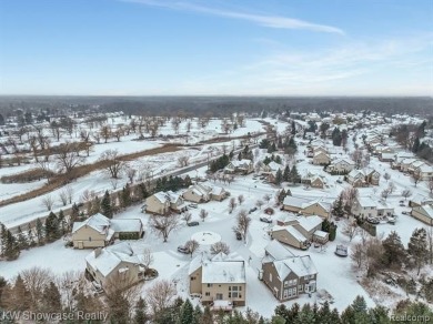 Nestled in the heart of Commerce Township, this grand 4-bedroom on Union Lake Golf Course in Michigan - for sale on GolfHomes.com, golf home, golf lot