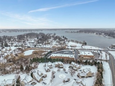 Nestled in the heart of Commerce Township, this grand 4-bedroom on Union Lake Golf Course in Michigan - for sale on GolfHomes.com, golf home, golf lot