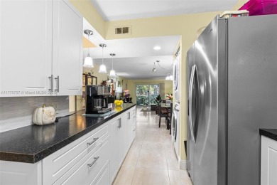 Enjoy the scenic garden view in this beautifully updated on Inverrary Country Club in Florida - for sale on GolfHomes.com, golf home, golf lot