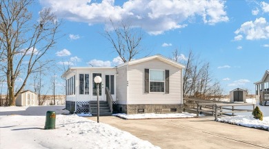 Charming and well-maintained 2006 mobile home offers the perfect on Lake of the Woods Golf Course in Illinois - for sale on GolfHomes.com, golf home, golf lot