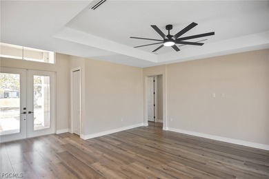 Come view this gorgeous brand-new home nestled feet away from on Burnt Store Golf Club in Florida - for sale on GolfHomes.com, golf home, golf lot