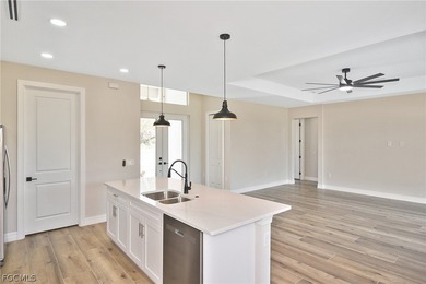 Come view this gorgeous brand-new home nestled feet away from on Burnt Store Golf Club in Florida - for sale on GolfHomes.com, golf home, golf lot