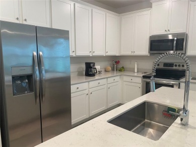 Step into modern comfort in this stunning 3-bedroom, 2-bathroom on Candler Hills Golf and Country Club in Florida - for sale on GolfHomes.com, golf home, golf lot