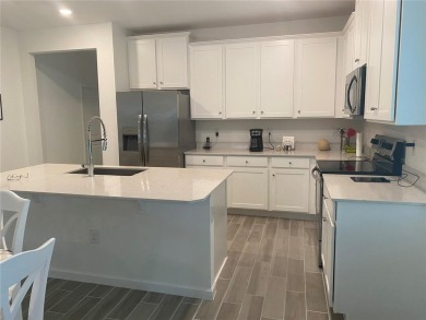 Step into modern comfort in this stunning 3-bedroom, 2-bathroom on Candler Hills Golf and Country Club in Florida - for sale on GolfHomes.com, golf home, golf lot