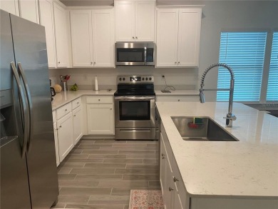 Step into modern comfort in this stunning 3-bedroom, 2-bathroom on Candler Hills Golf and Country Club in Florida - for sale on GolfHomes.com, golf home, golf lot