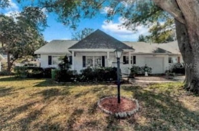Welcome to this beautifully maintained 2-bedroom, 2-bath end on On Top of the World Golf Course in Florida - for sale on GolfHomes.com, golf home, golf lot