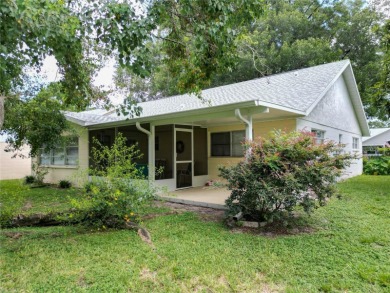 Welcome to this beautifully maintained 2-bedroom, 2-bath end on On Top of the World Golf Course in Florida - for sale on GolfHomes.com, golf home, golf lot