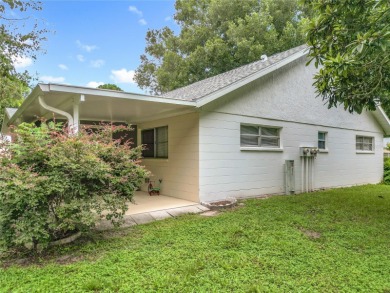 Welcome to this beautifully maintained 2-bedroom, 2-bath end on On Top of the World Golf Course in Florida - for sale on GolfHomes.com, golf home, golf lot