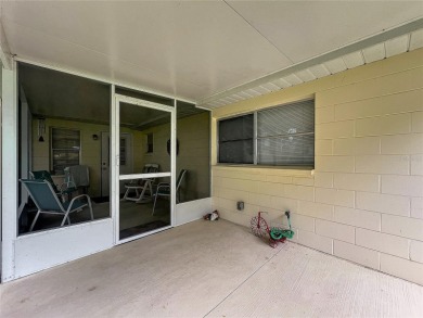 Welcome to this beautifully maintained 2-bedroom, 2-bath end on On Top of the World Golf Course in Florida - for sale on GolfHomes.com, golf home, golf lot