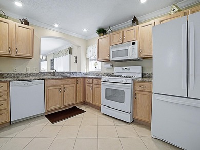 WARM AND WELCOMING this Beauregard villa is nestled in Greenwood on Oakleigh Executive Golf Course in Florida - for sale on GolfHomes.com, golf home, golf lot