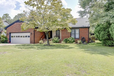 Welcome to 6106 Cutlass Court, a charming brick ranch-style home on Harbour Point Golf Club in North Carolina - for sale on GolfHomes.com, golf home, golf lot