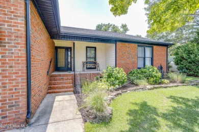 Welcome to 6106 Cutlass Court, a charming brick ranch-style home on Harbour Point Golf Club in North Carolina - for sale on GolfHomes.com, golf home, golf lot