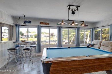 Welcome to 6106 Cutlass Court, a charming brick ranch-style home on Harbour Point Golf Club in North Carolina - for sale on GolfHomes.com, golf home, golf lot