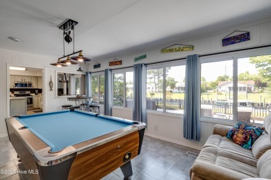 Welcome to 6106 Cutlass Court, a charming brick ranch-style home on Harbour Point Golf Club in North Carolina - for sale on GolfHomes.com, golf home, golf lot