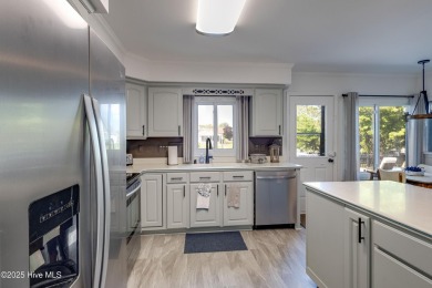 Welcome to 6106 Cutlass Court, a charming brick ranch-style home on Harbour Point Golf Club in North Carolina - for sale on GolfHomes.com, golf home, golf lot