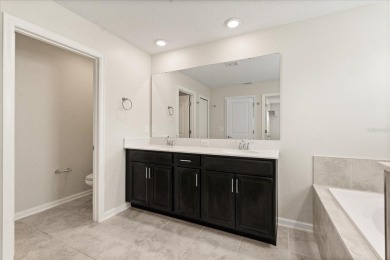**This property qualifies for a closing cost credit up to $5,700 on ChampionsGate Golf Resort in Florida - for sale on GolfHomes.com, golf home, golf lot