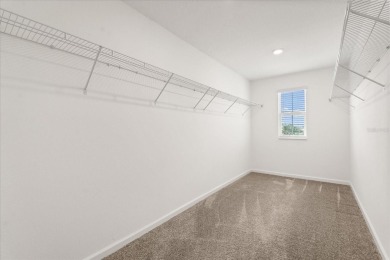 **This property qualifies for a closing cost credit up to $5,700 on ChampionsGate Golf Resort in Florida - for sale on GolfHomes.com, golf home, golf lot