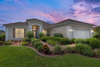 This elegant SANTA ROSA home sits proudly on a corner lot of a on Eagle Ridge At Spruce Creek Country Club in Florida - for sale on GolfHomes.com, golf home, golf lot