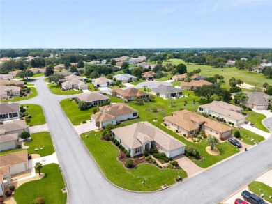 This elegant SANTA ROSA home sits proudly on a corner lot of a on Eagle Ridge At Spruce Creek Country Club in Florida - for sale on GolfHomes.com, golf home, golf lot
