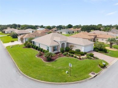 This elegant SANTA ROSA home sits proudly on a corner lot of a on Eagle Ridge At Spruce Creek Country Club in Florida - for sale on GolfHomes.com, golf home, golf lot