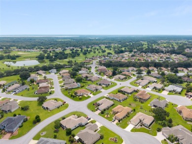 This elegant SANTA ROSA home sits proudly on a corner lot of a on Eagle Ridge At Spruce Creek Country Club in Florida - for sale on GolfHomes.com, golf home, golf lot