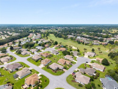 This elegant SANTA ROSA home sits proudly on a corner lot of a on Eagle Ridge At Spruce Creek Country Club in Florida - for sale on GolfHomes.com, golf home, golf lot
