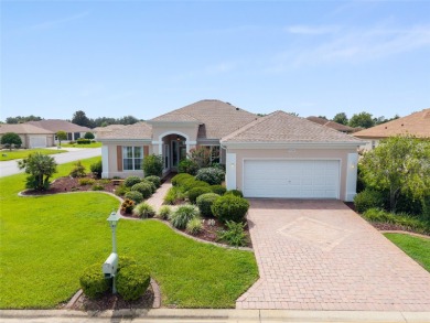 This elegant SANTA ROSA home sits proudly on a corner lot of a on Eagle Ridge At Spruce Creek Country Club in Florida - for sale on GolfHomes.com, golf home, golf lot