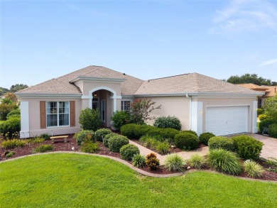 This elegant SANTA ROSA home sits proudly on a corner lot of a on Eagle Ridge At Spruce Creek Country Club in Florida - for sale on GolfHomes.com, golf home, golf lot