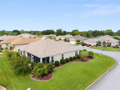This elegant SANTA ROSA home sits proudly on a corner lot of a on Eagle Ridge At Spruce Creek Country Club in Florida - for sale on GolfHomes.com, golf home, golf lot