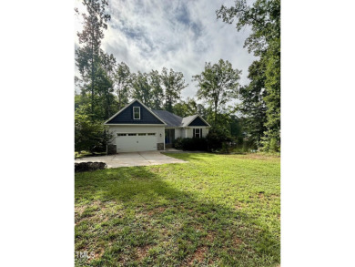 Welcome to 1119 Sagamore Drive, a stunning custom waterfront on River Golf and County Club at Lake Royale in North Carolina - for sale on GolfHomes.com, golf home, golf lot