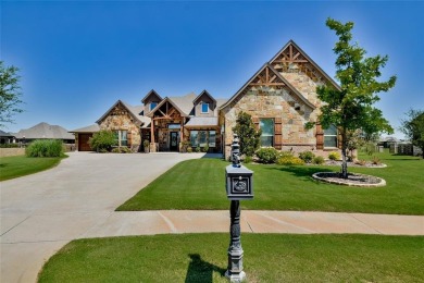 Spectacular custom home nestled on a quiet cul-de-sac with on Pecan Plantation Country Club in Texas - for sale on GolfHomes.com, golf home, golf lot